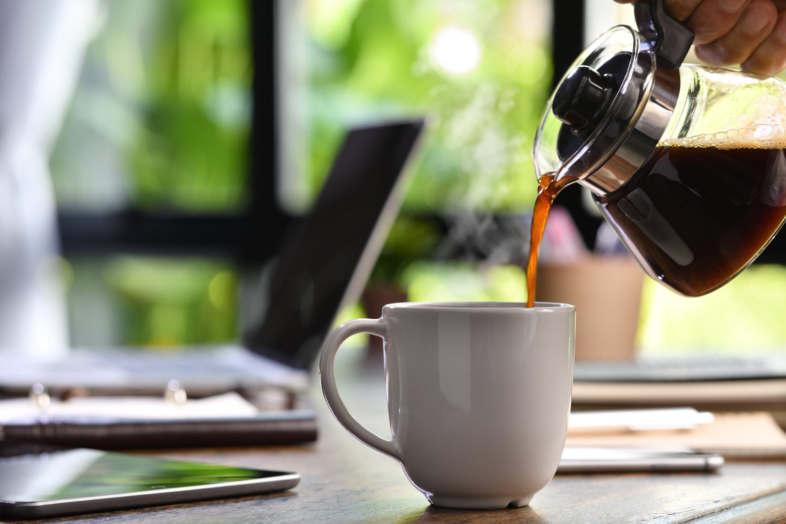 Focused professional working with coffee